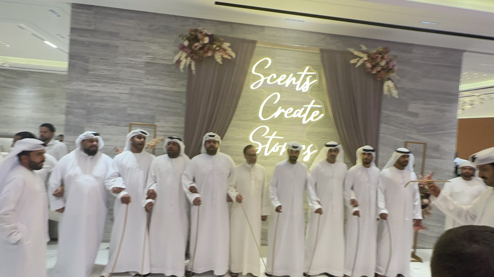 Traditional Al Ayala performance in front of the Scents Create Stories installation at the Al Haramain event