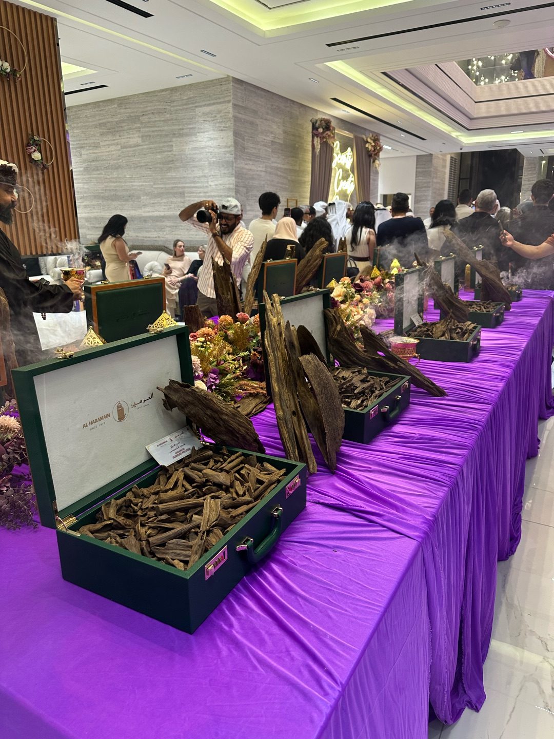 Display of premium oud varieties in Al Haramain cases at the Dubai event